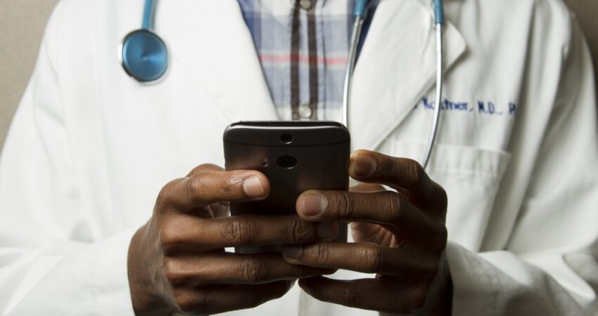 Doctor holding smartphone