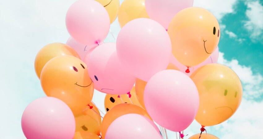 balloons with happy face to illustrate a happy successful transition of adult children and aging parents living together