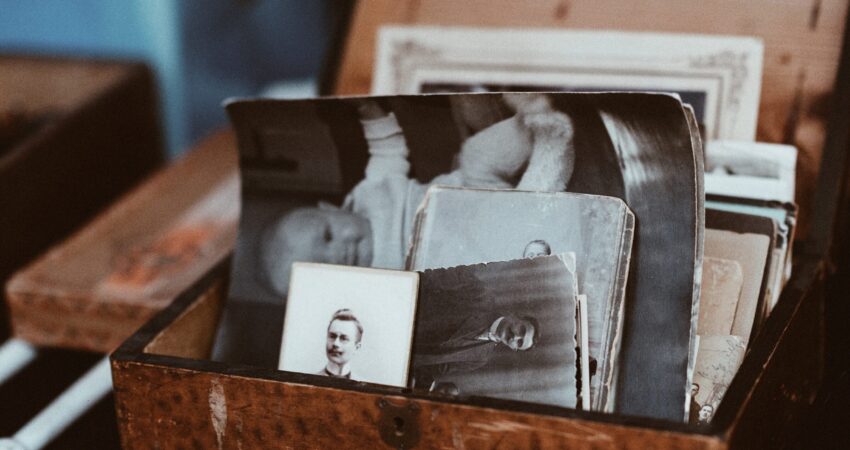 old photos in brown wooden chest
