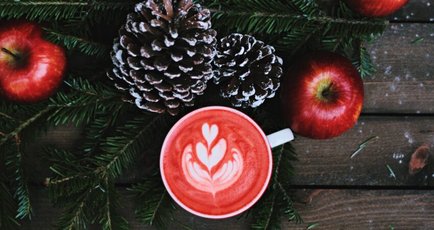 red coffee latte on white ceramic mug